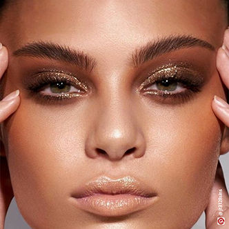 Smokey eye makeup with gold shimmer eyeshadow