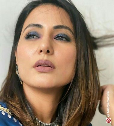 Hina Khan wearing blue eyeshadow and mauve lipstick