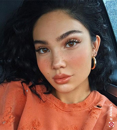 Model wearing faux freckles and blush