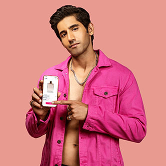 Varun Sood in pink clicking on a toggle on the Nykaa app