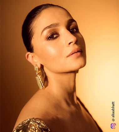 Alia Bhatt wearing gold eyeshadow and kajal
