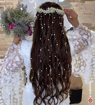 Curls hairstyle embellished with pearls
