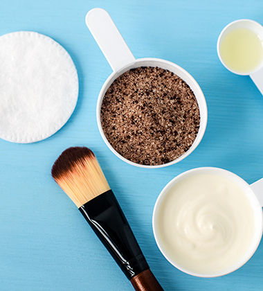 greek yoghurt and coffee powder placed next to a makeup brush