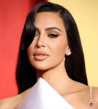 Kim  KArdashian in a side swept bangs