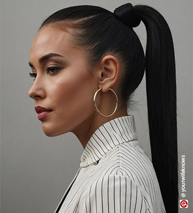 woman wearing golden earrings with a sleek ponytail