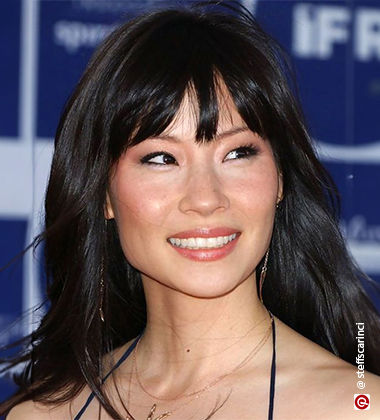 smiling woman with choppy bangs  