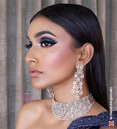 blue eyeshadow look on a woman wearing a blue dress