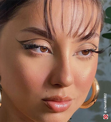 close-up of a woman wearing a graphic liner