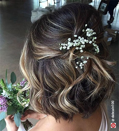 bridesmaid hairstyle - pulled back flowers 