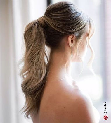 bridesmaid hair dos - low pony with a pouffe 