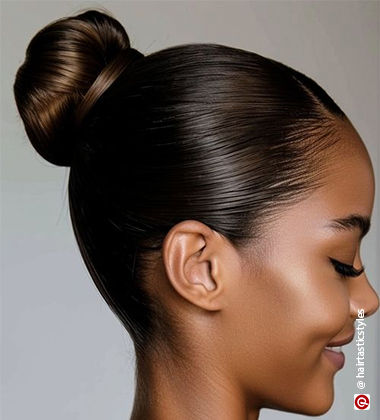 woman’s right face profile with a high bun
