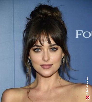 Dakota Johnson in messy bun hairstyle
