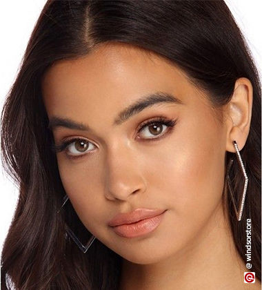 woman wearing rectangular hoop earrings