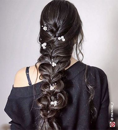 woman wearing a black outfit with loose braid