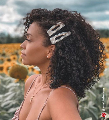 Accessorised Side Part Curly Hairstyle
