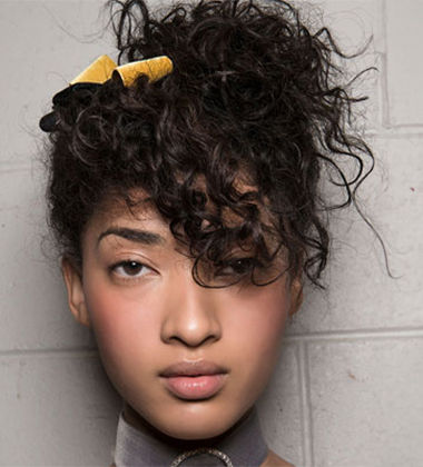 Loosely Swept Up Curly Hairstyle
