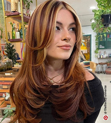 woman with black top and blue pants
