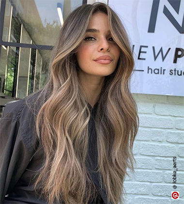 woman smiling with Foilayage hair
