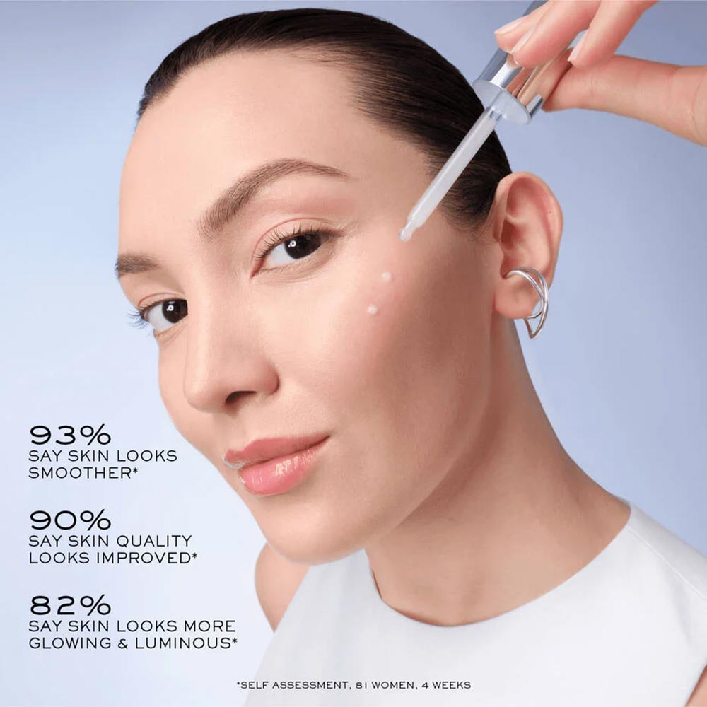 woman applying the serum to her face