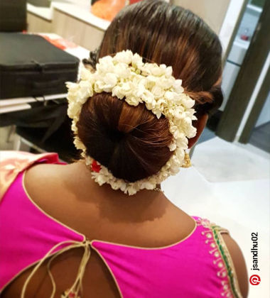 indian wedding hairstyles - classic bun with flowers