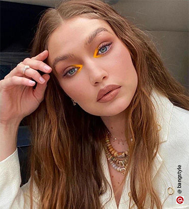 bare faced skin-like makeup with a yellow pop of colour