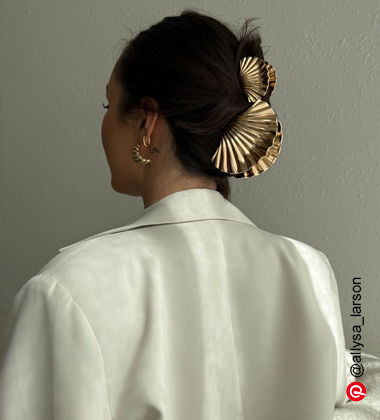 woman wearing golden clutcher