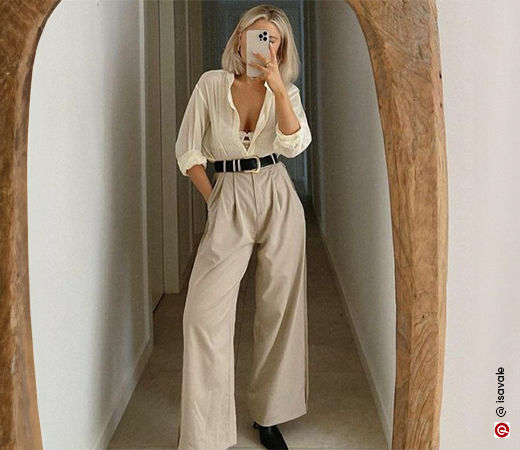 Woman wearing a beige shirt and trousers