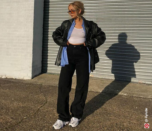 Oversized shirt layered under leather jacket