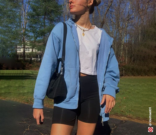Women wearing a blue hoodie