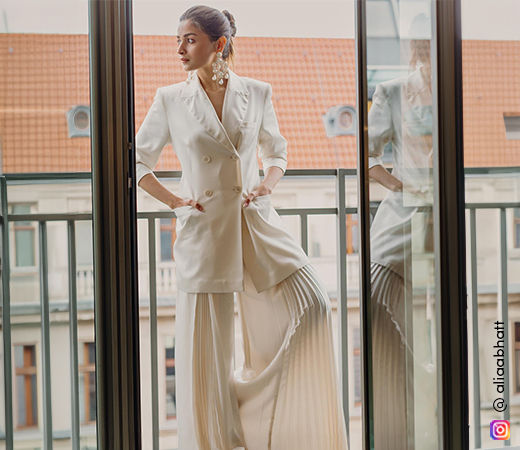 Alia Bhatt wearing white pleated flared pants and jacket