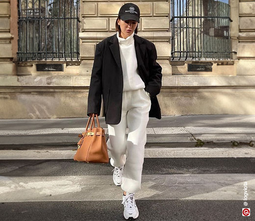 Woman wearing a blazer with co-ord joggers and turtleneck