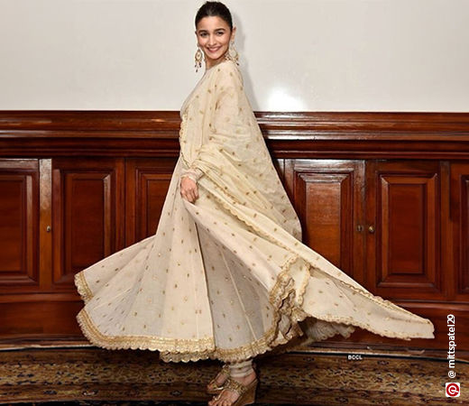 Alia Bhatt wearing an ivory Anarkali suit