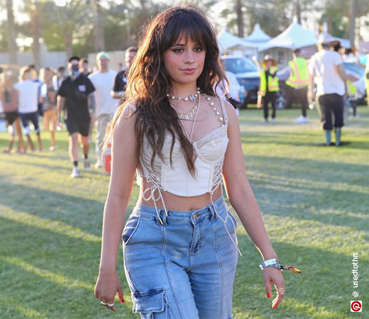 Camila Cabello wearing a crop top and jeans
