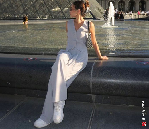 Woman wearing vest and trousers