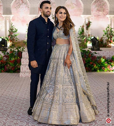 bride and groom wearing navy blue and silver