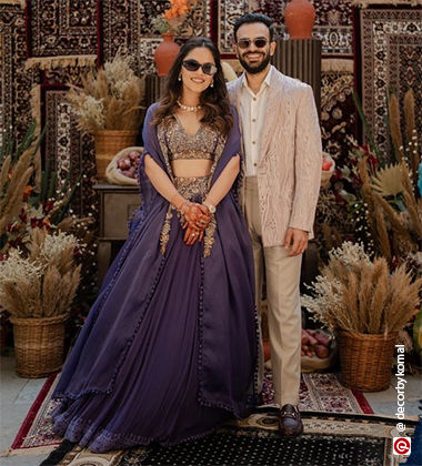 the couple wearing purple and cream