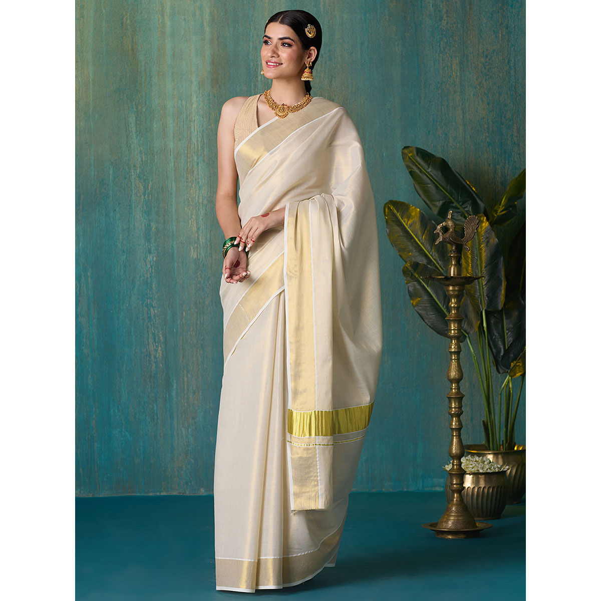 Kerala off-white with black golden zari border semi tissue handwoven and  hand painted mural designed saree