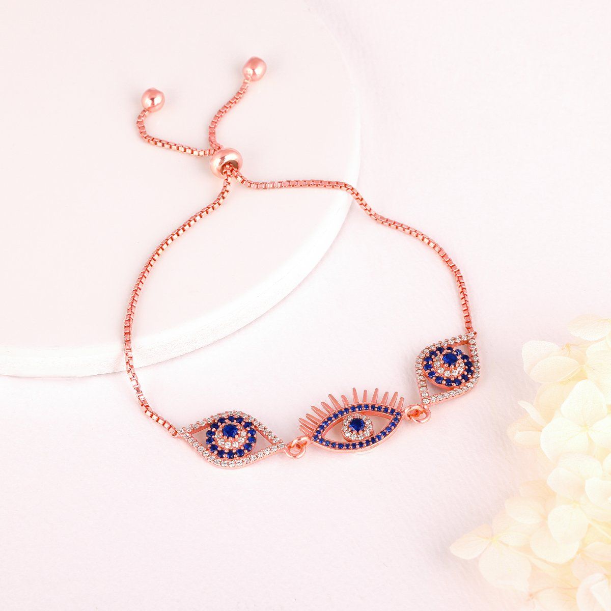 GIVA Sterling Silver Rose Gold Blue Stone Studded Evil Eye Bracelet for