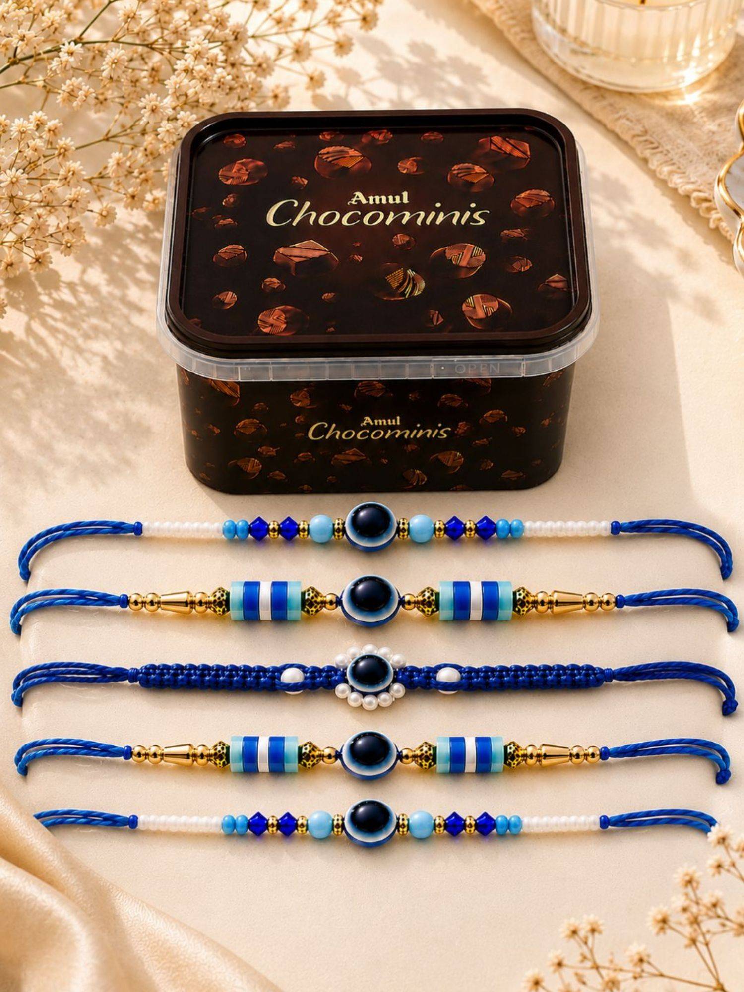 VIRAASI Blue Evil Eye Rakhi Gift Set of 5 with Chocolate