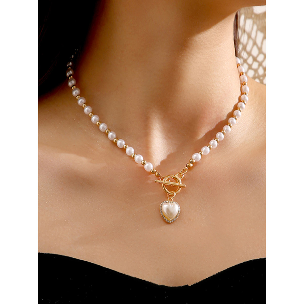 heart necklace with pearl inside