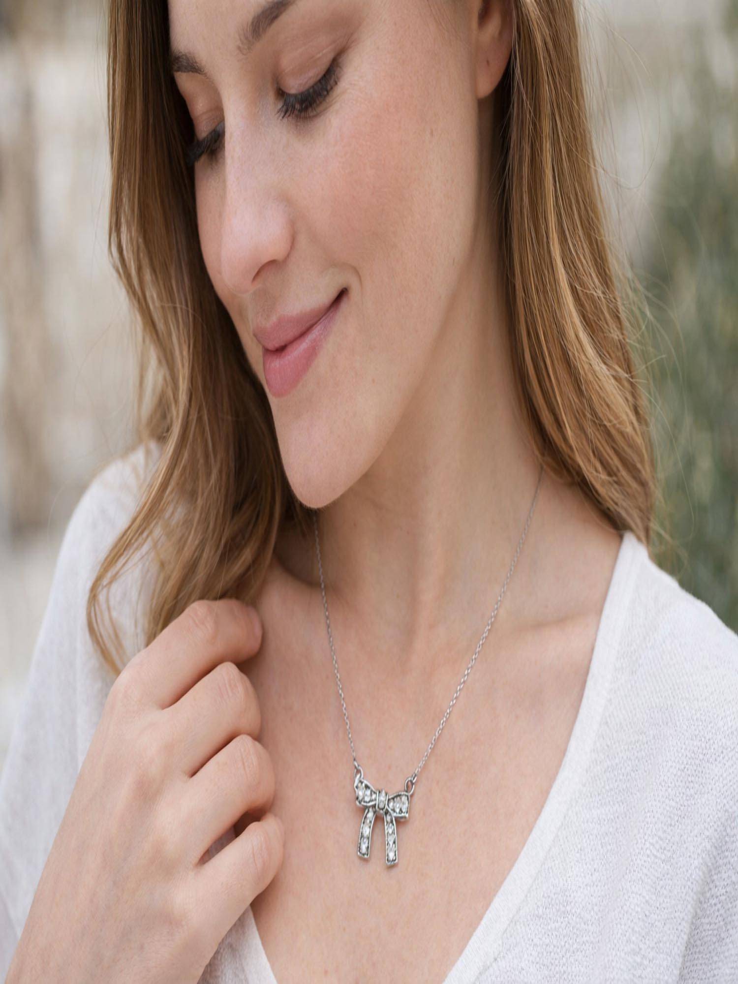 Jewelz Silver Plated Crystal Bow Necklace For Women