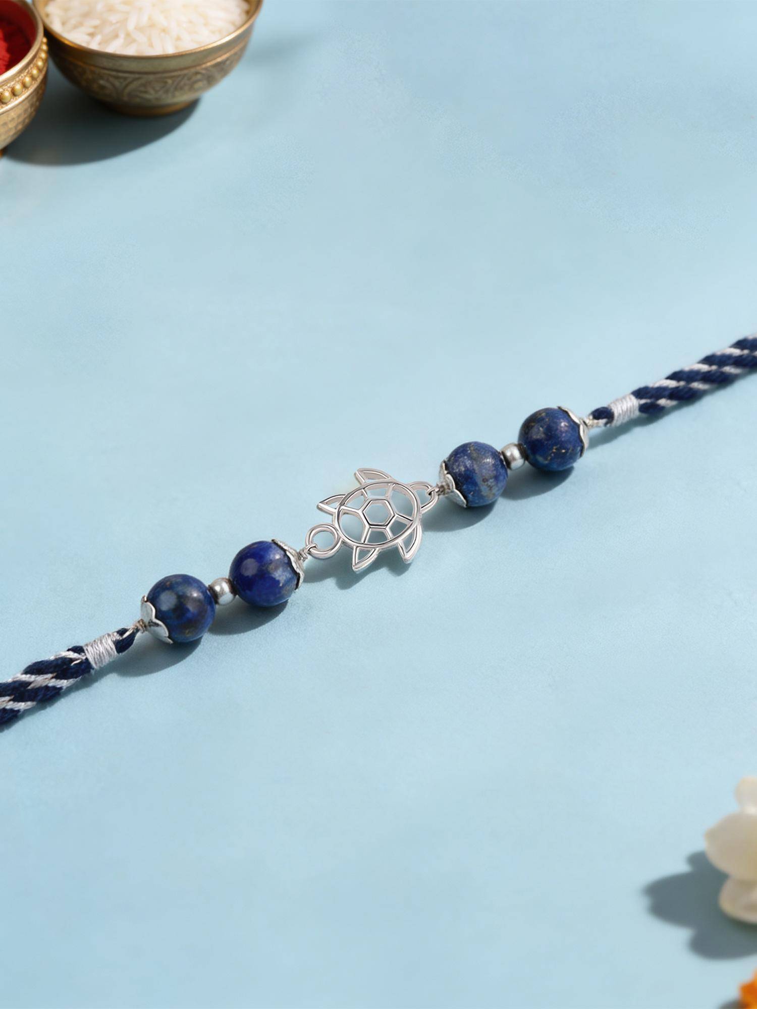 Ornate Jewels 925 Silver Blue Lapis Tortoise Good Luck Thread Rakhi With Roli Chawal for Brother