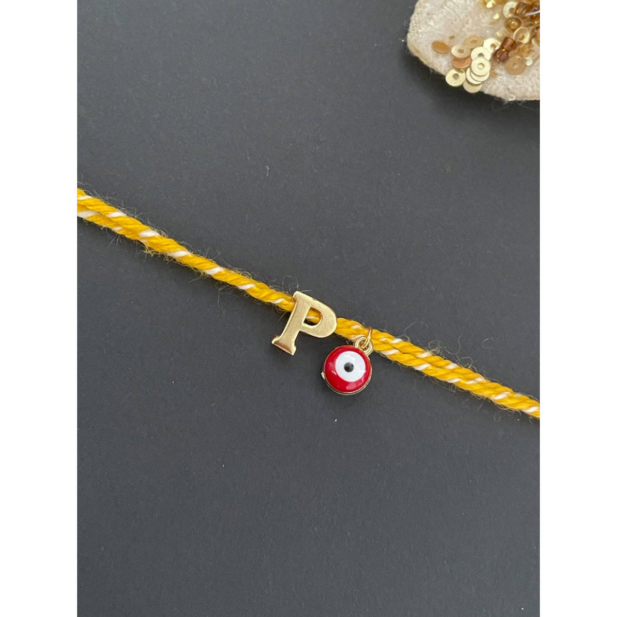 Digital Dress Room Letter "P" Initial & Red Evil Eye Rakhi