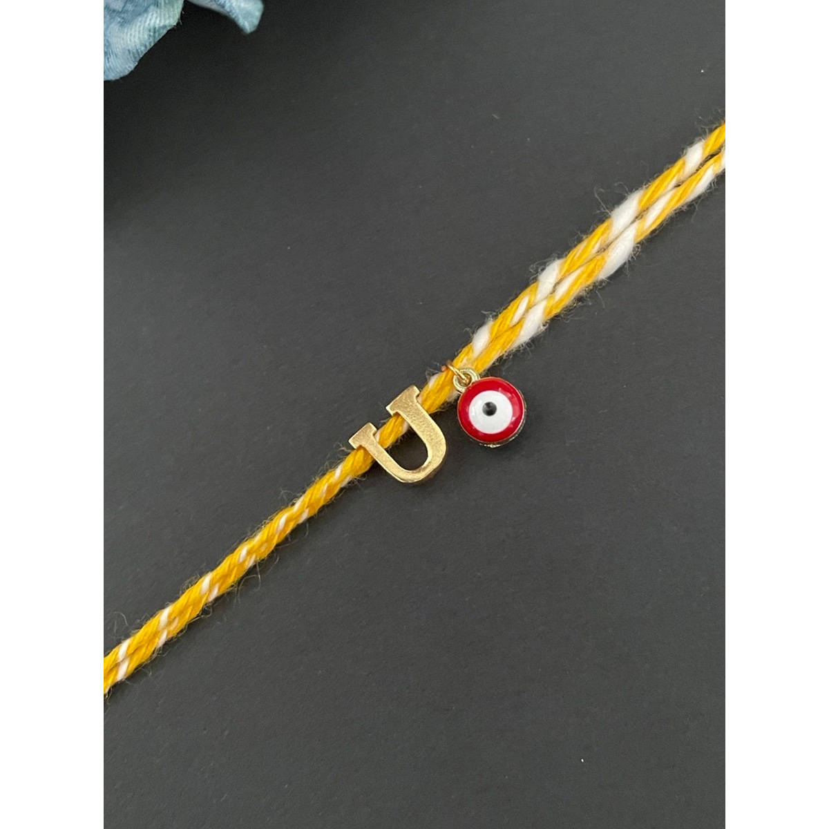 Digital Dress Room Letter "U" Initial & Red Evil Eye Rakhi