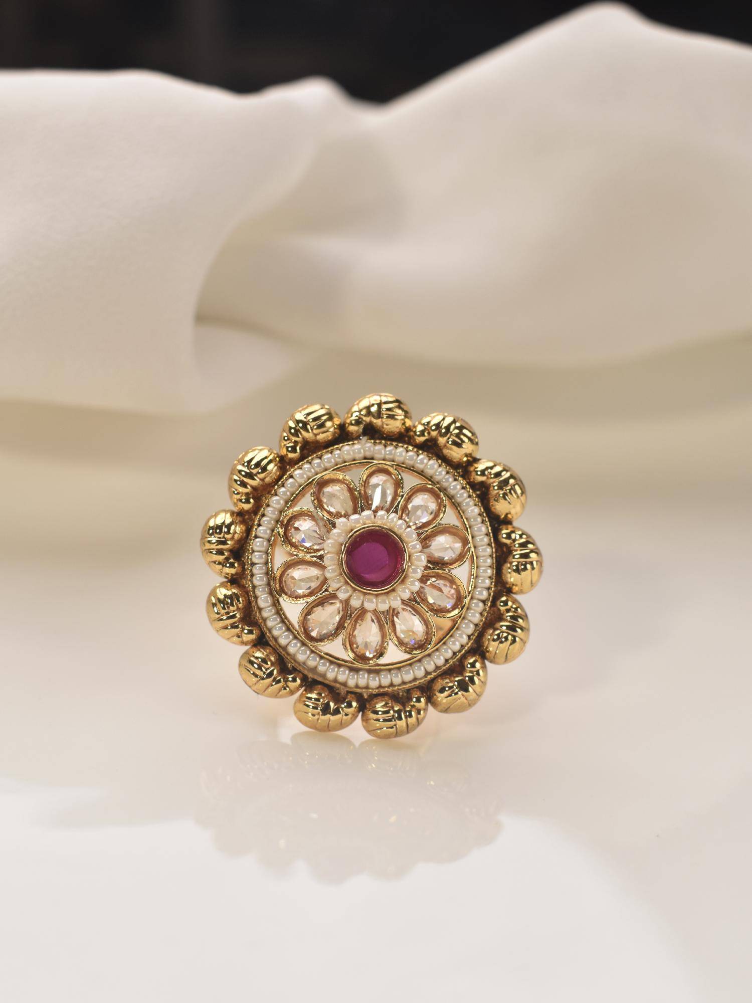 Peach Tassels Golden Finger Ring with a Red Gemstone