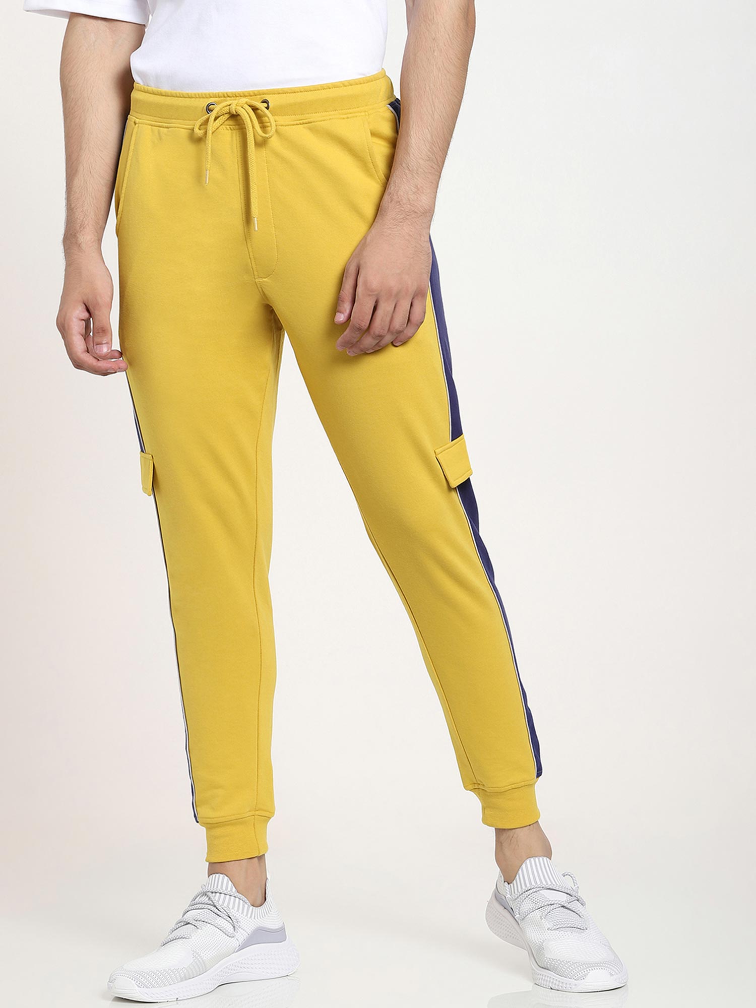 yellow joggers with black stripe