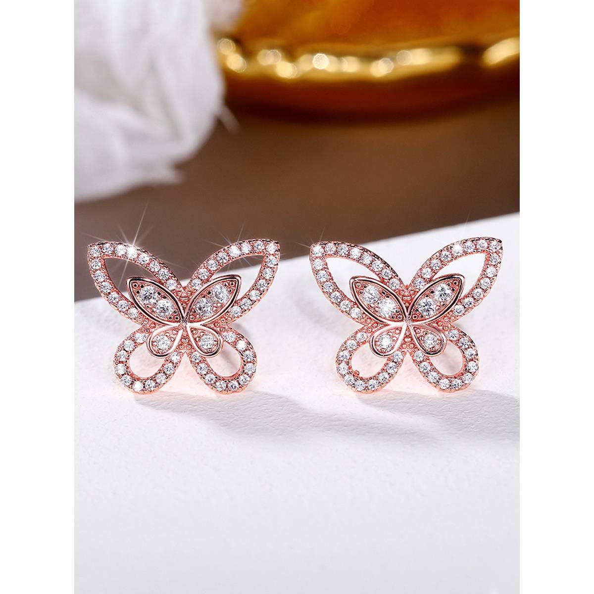 Jewels Galaxy Rose Gold Plated American Diamond White Studded Butterfly Shaped Korean Earrings