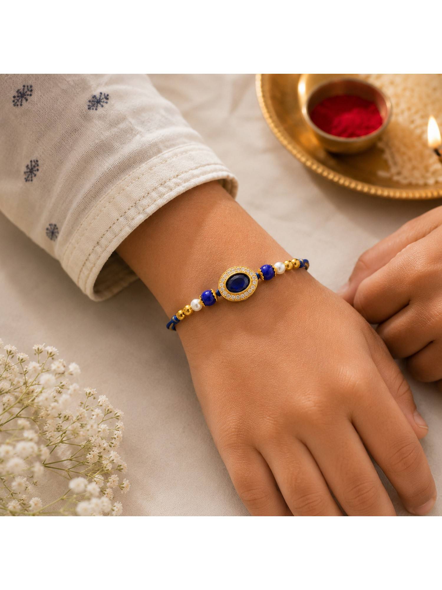 REENISAA Royal Blue Crystal and Pearl Designer Rakhi