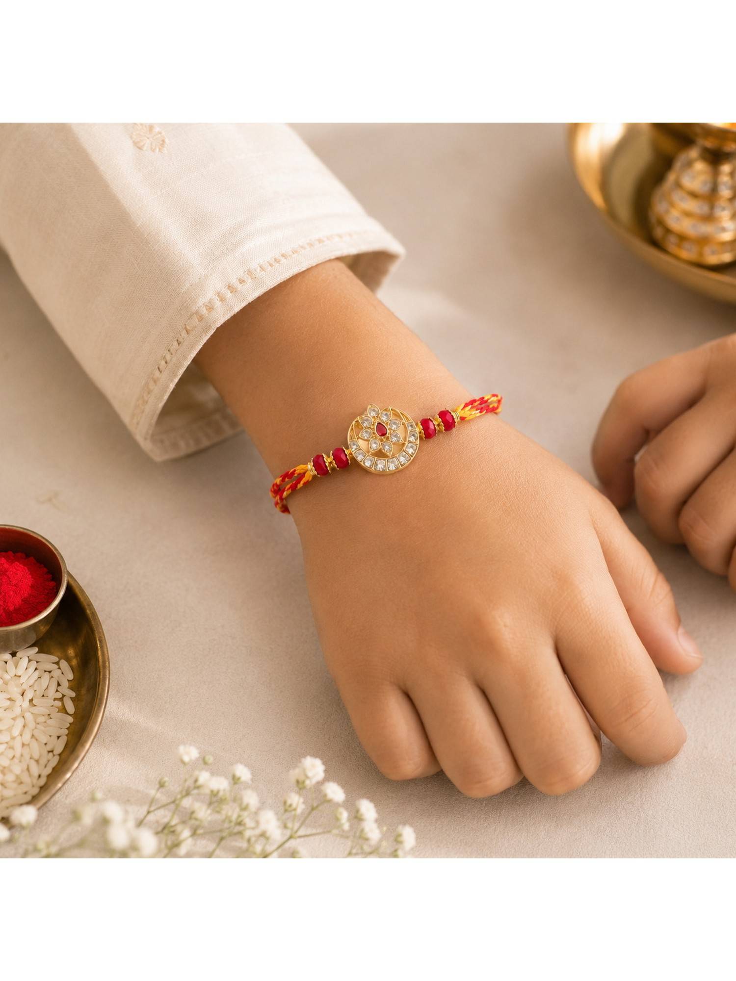 REENISAA Red Radiance Handmade Rakhi with Crystal Floral Medallion