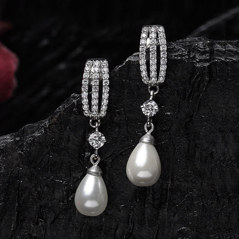 Sterling silver artisan pearl earrings at 2550  Azilaa